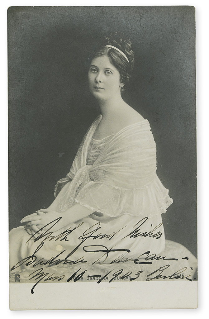 DUNCAN, ISADORA. Photograph Postcard Signed and Inscribed, With Good Wishes / Isadora Duncan / Mars 10-1903 Berlin,